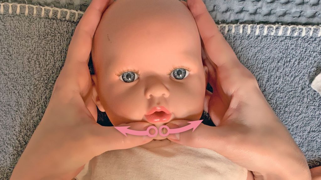 Babymassage Anleitung: Bitte lächeln!